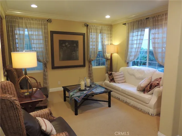 a living room with furniture and a lamp