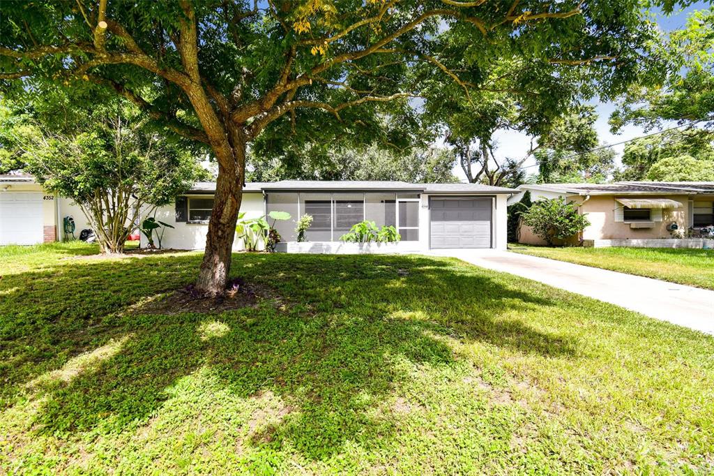 4348 Shoreline Drive New Port Richey, FL 34652 - Photo 1 of 1 a view of house with a backyard