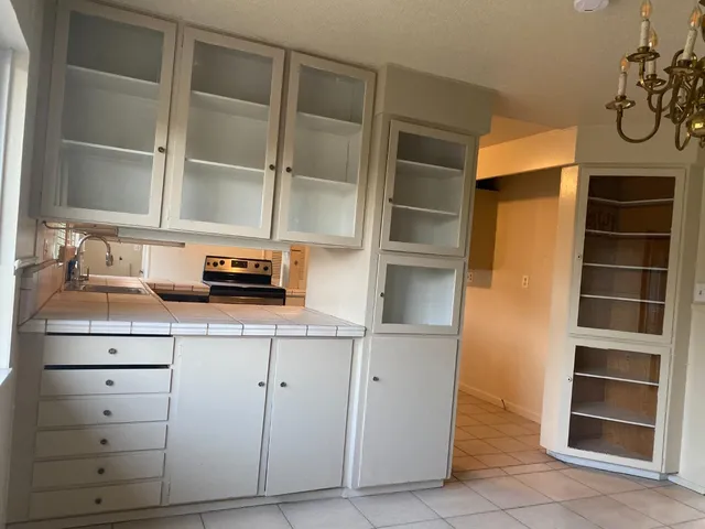 a kitchen with a cabinets and a stove