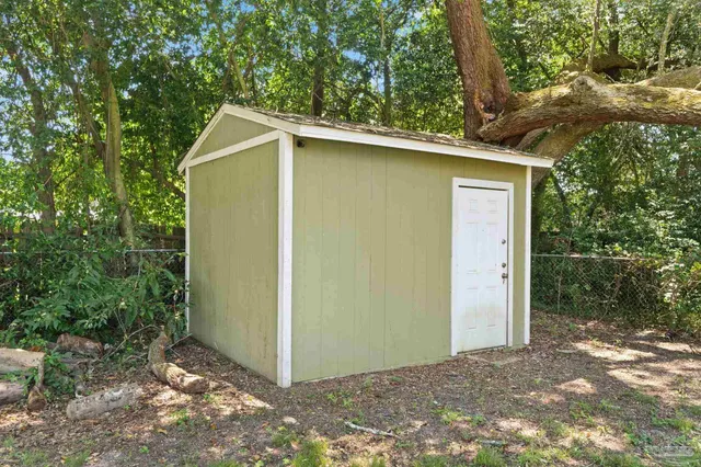 a view of a house with a tree