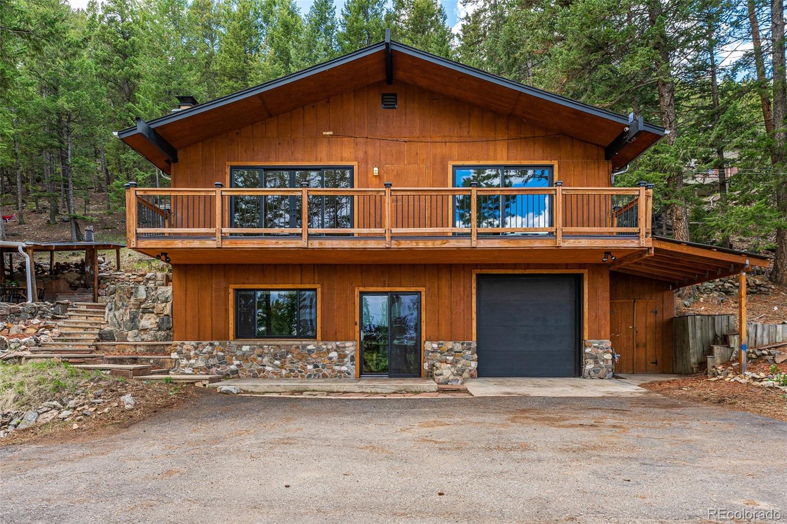 a front view of a house with garage