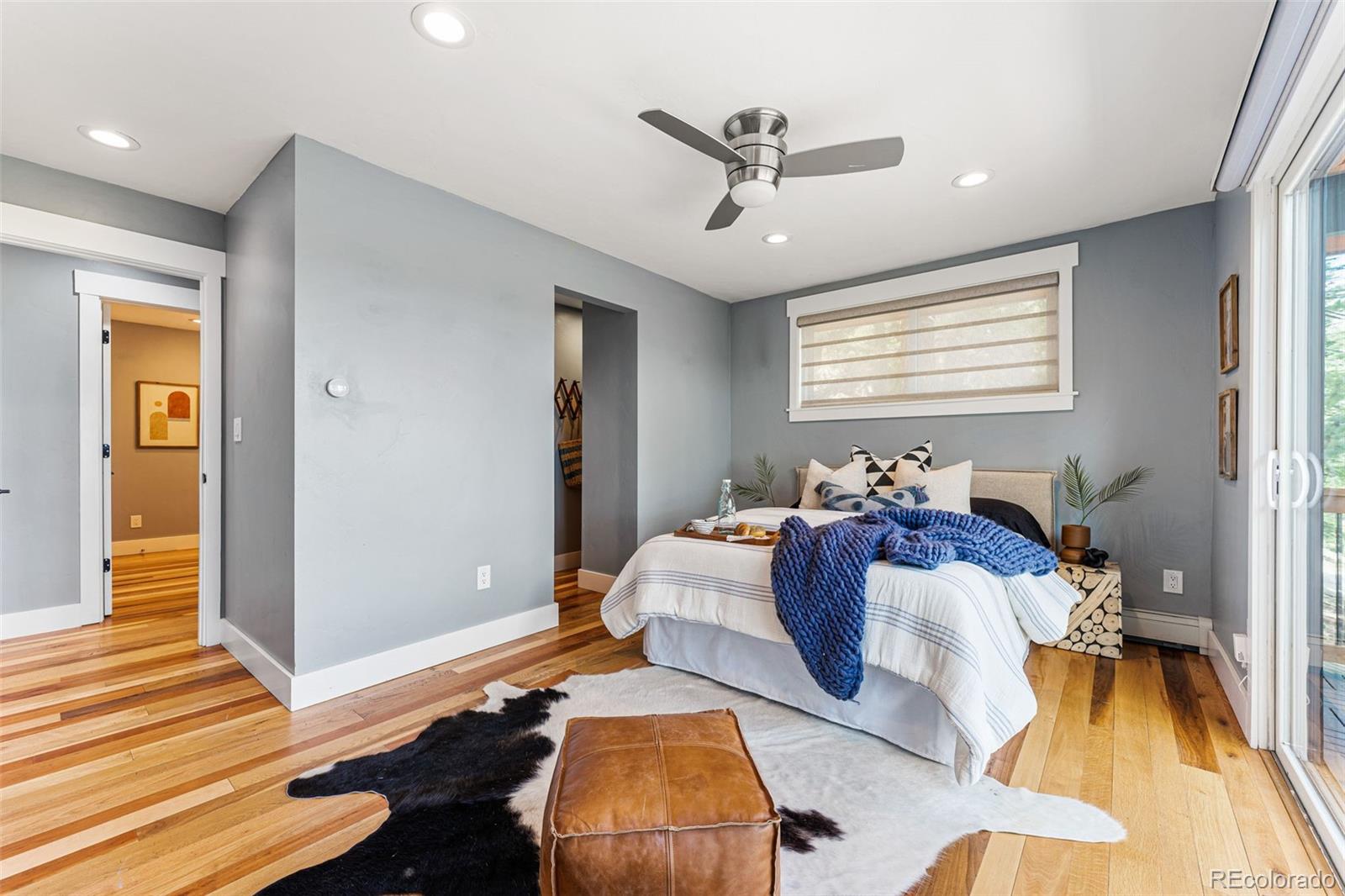 30242 Pine Crest Drive Evergreen, CO 80439 - Photo 13 of 28 a bedroom with furniture and a window