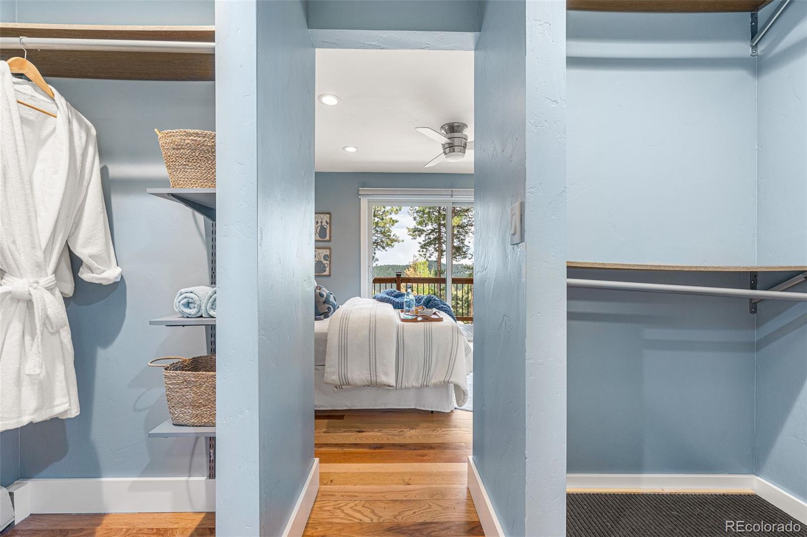 30242 Pine Crest Drive Evergreen, CO 80439 - Photo 14 of 28 a view of bedroom with furniture and wooden floor
