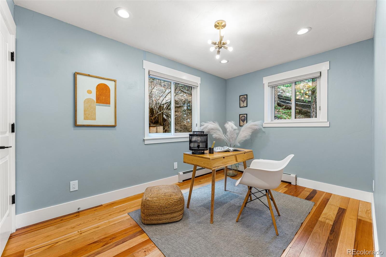 30242 Pine Crest Drive Evergreen, CO 80439 - Photo 16 of 28 a workspace with wooden floor and a window