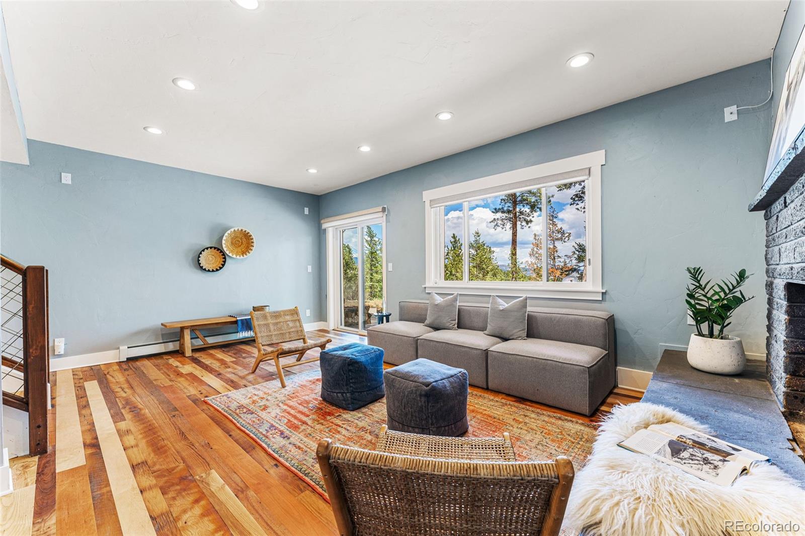 30242 Pine Crest Drive Evergreen, CO 80439 - Photo 18 of 28 a living room with furniture and a large window