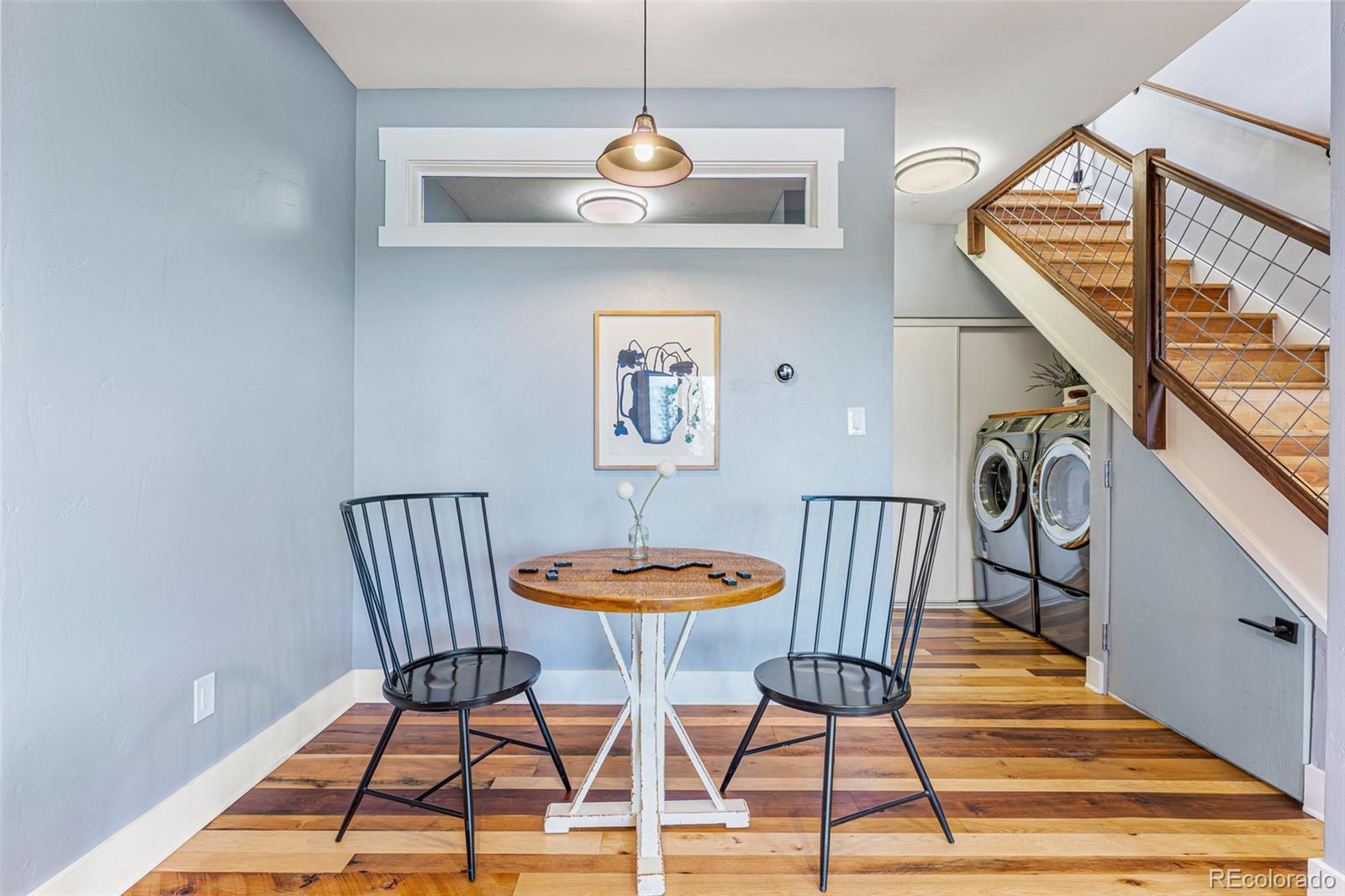 30242 Pine Crest Drive Evergreen, CO 80439 - Photo 20 of 28 a view of a dining room with furniture and wooden floor