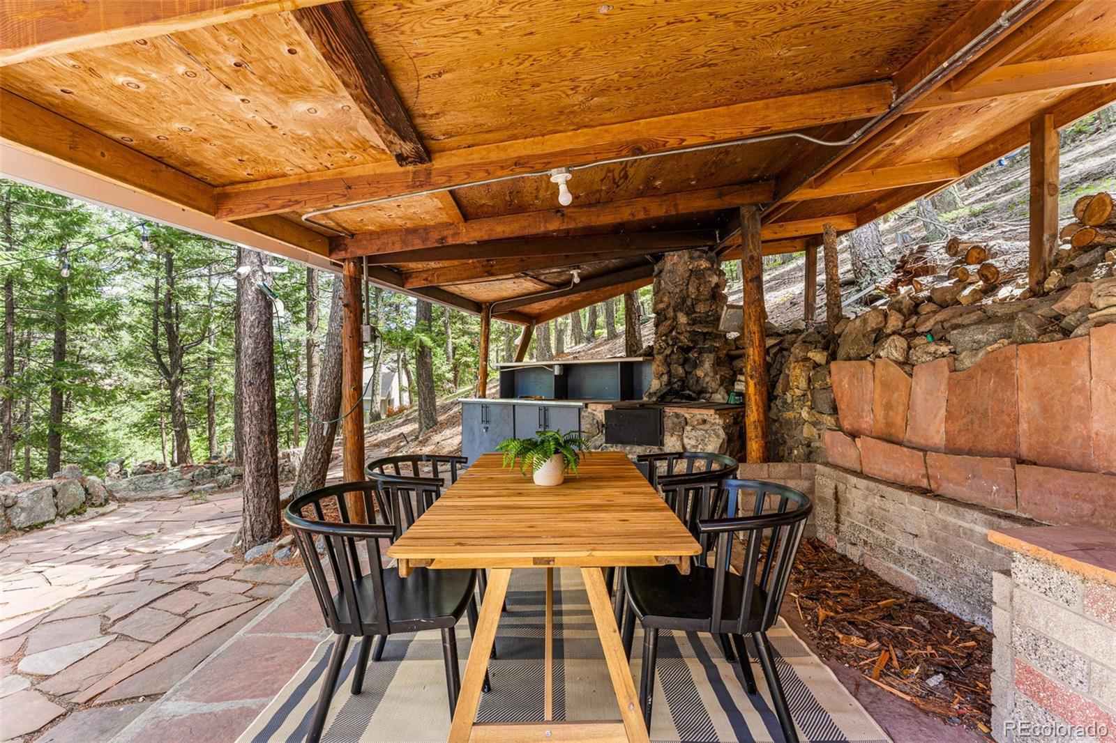 30242 Pine Crest Drive Evergreen, CO 80439 - Photo 24 of 28 a outdoor view with a sitting space