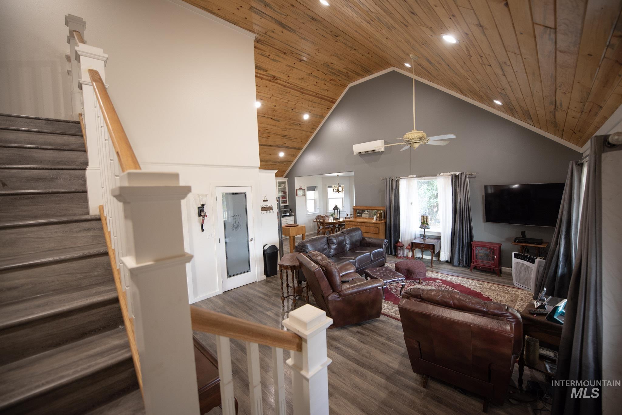 41167 Little Canyon Road Peck, ID 83545 - Photo 5 of 8 Vaulted wood-finish ceiling with recessed lighting, wood-finish flooring, and a staircase with white balusters and wood-finish handrails