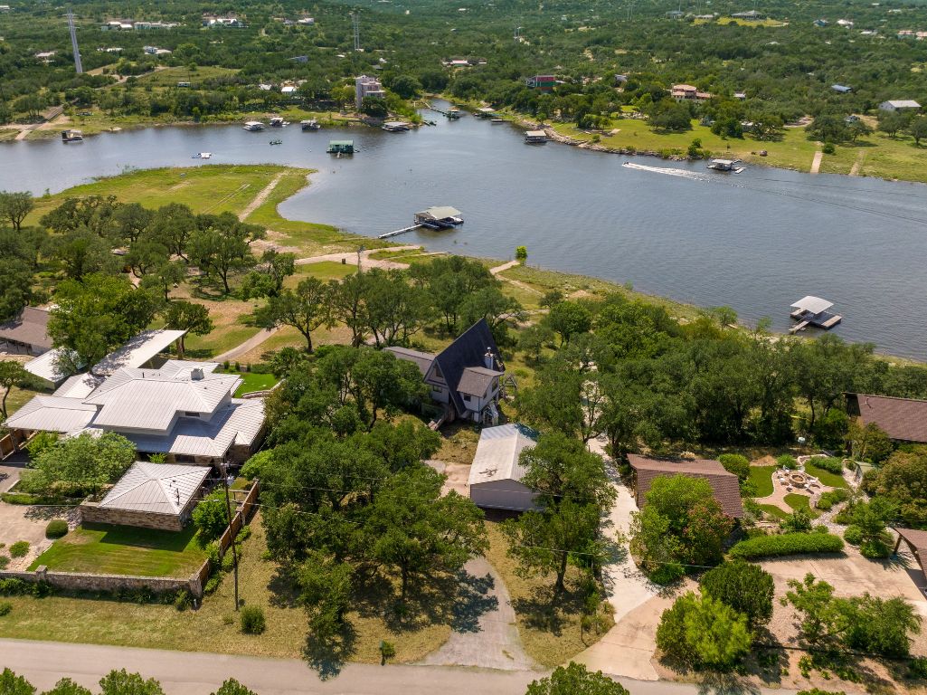19625 Lakehurst Loop Spicewood, TX 78669 - Photo 11 of 25 an aerial view of lake residential house with swimming pool and outdoor space