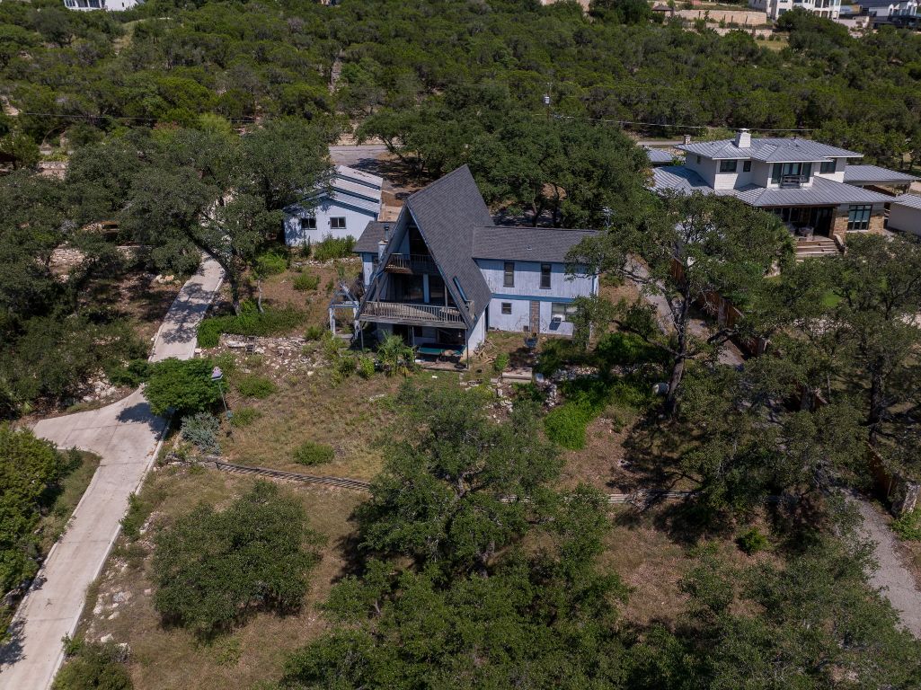 19625 Lakehurst Loop Spicewood, TX 78669 - Photo 23 of 25 an aerial view of a house with a yard and trees all around