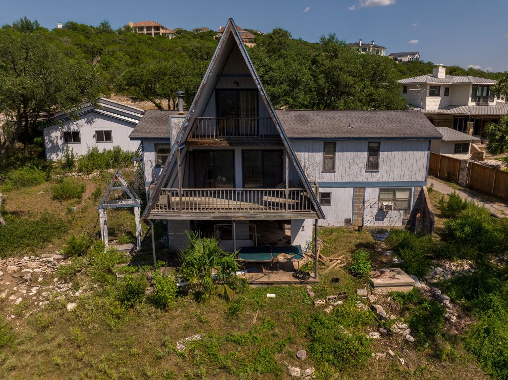 19625 Lakehurst Loop Spicewood, TX 78669 - Photo 24 of 25 a front view of a house with a yard