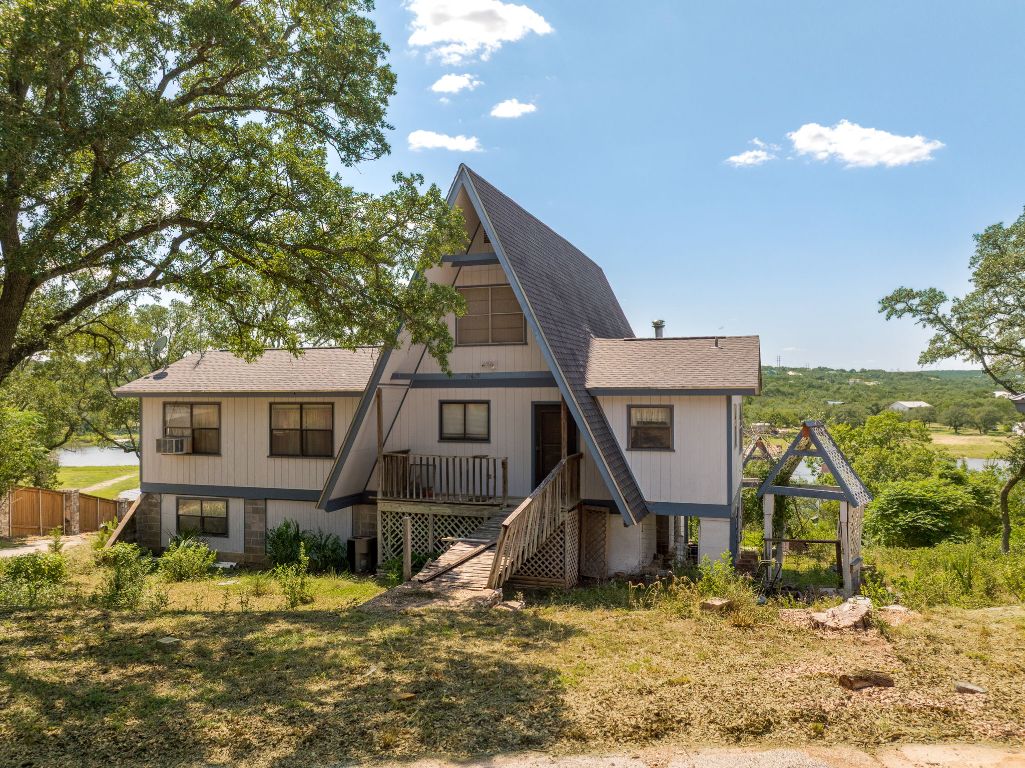 19625 Lakehurst Loop Spicewood, TX 78669 - Photo 5 of 25 a front view of a house with a yard