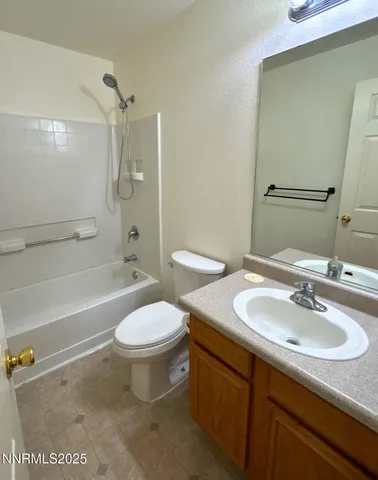 a bathroom with a sink toilet tub and shower