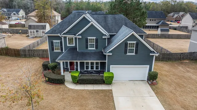 a front view of a house with garden