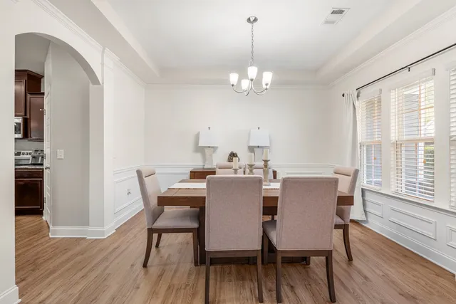 a kitchen with stainless steel appliances granite countertop a refrigerator stove and sink