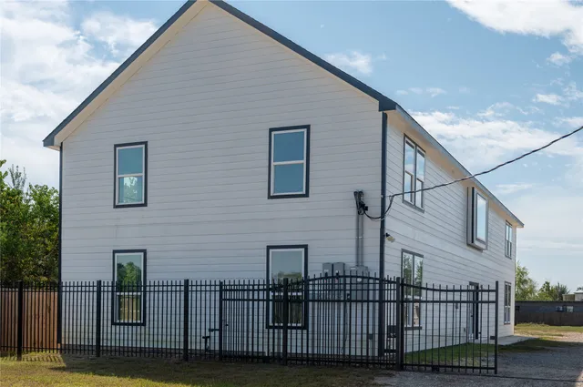 a view of a house with iron stairs