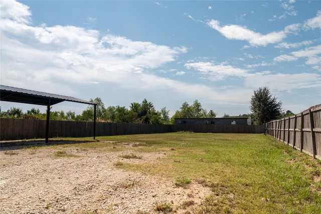 a view of swimming pool with a yard