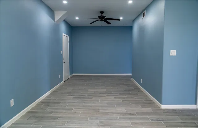 a view of a hallway with a chandelier