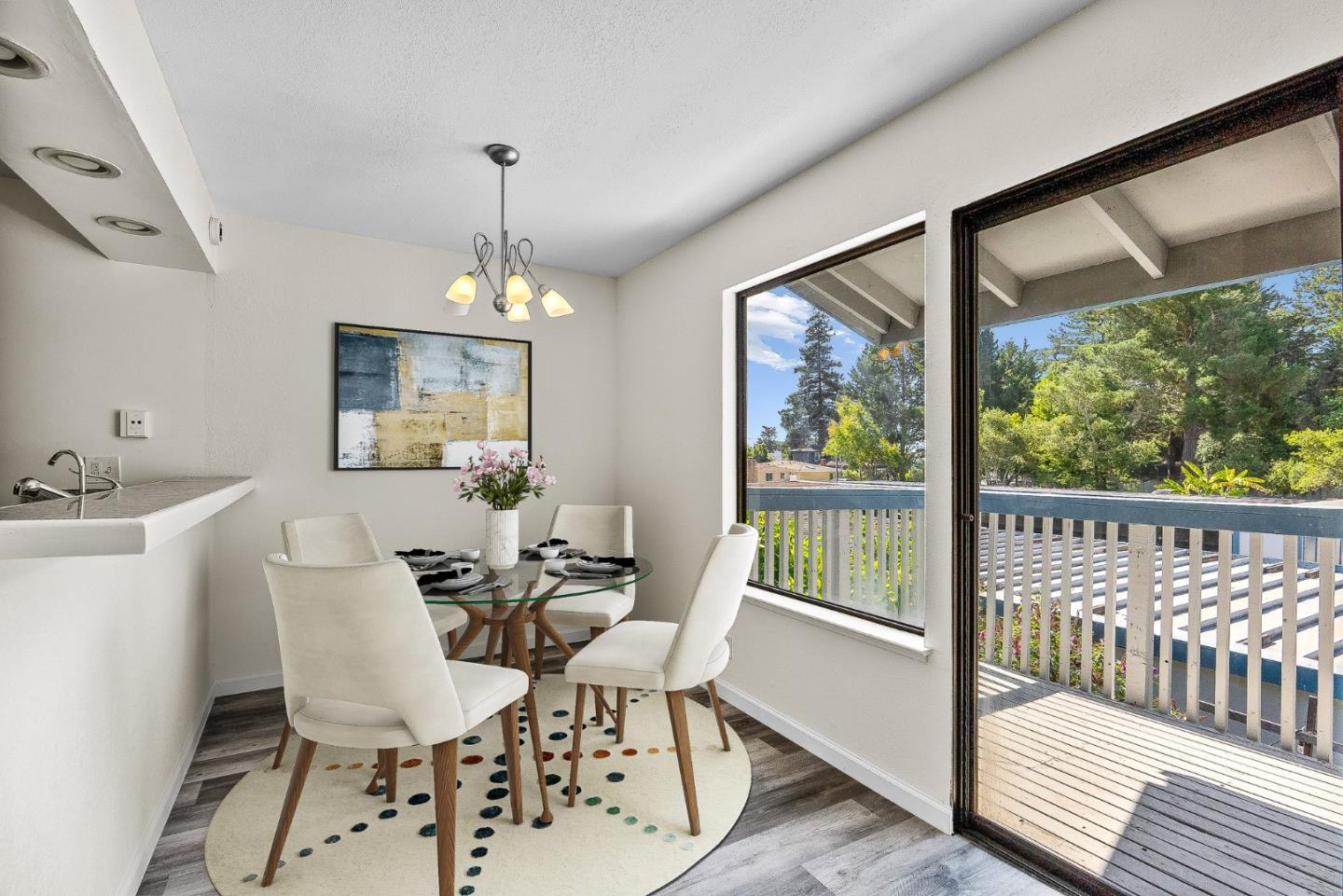 1925 46th Avenue, Unit 78 Capitola, CA 95010 - Photo 1 of 31 a dining room with furniture a chandelier and wooden floor
