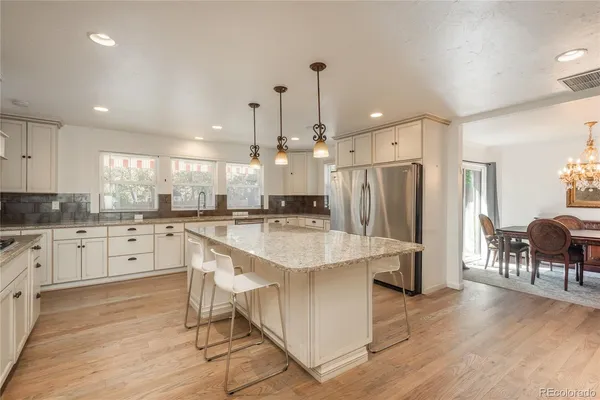 a bedroom with a bed a window and dresser