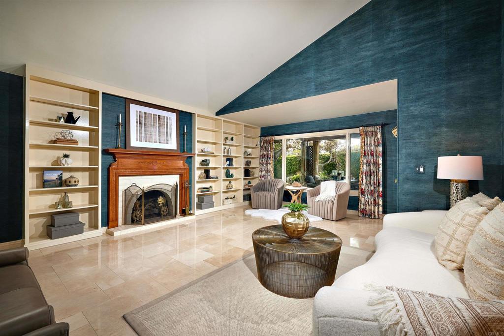 219 Calle De Sereno Encinitas, CA 92024 - Photo 22 of 43 a living room with furniture large window and a fireplace