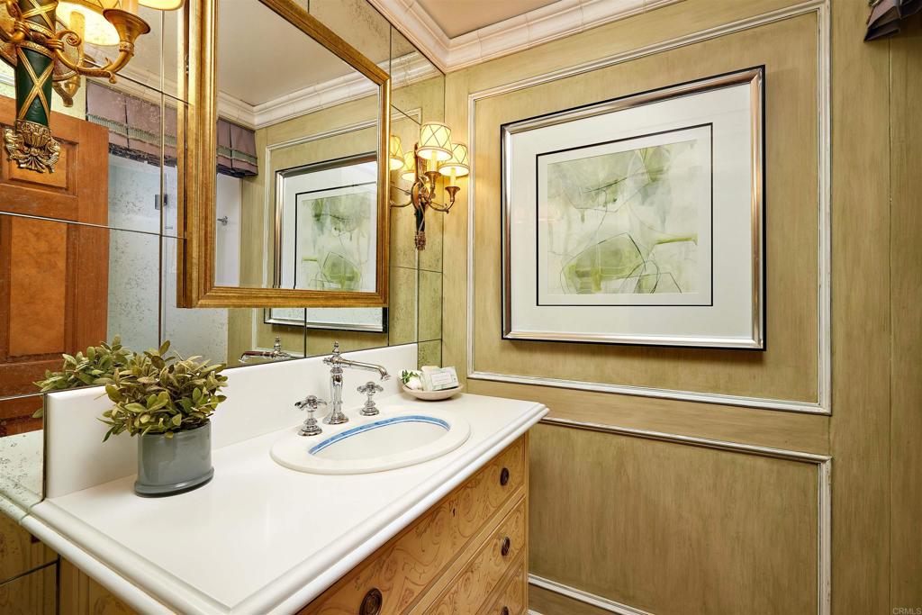 219 Calle De Sereno Encinitas, CA 92024 - Photo 30 of 43 a bathroom with a sink and a mirror