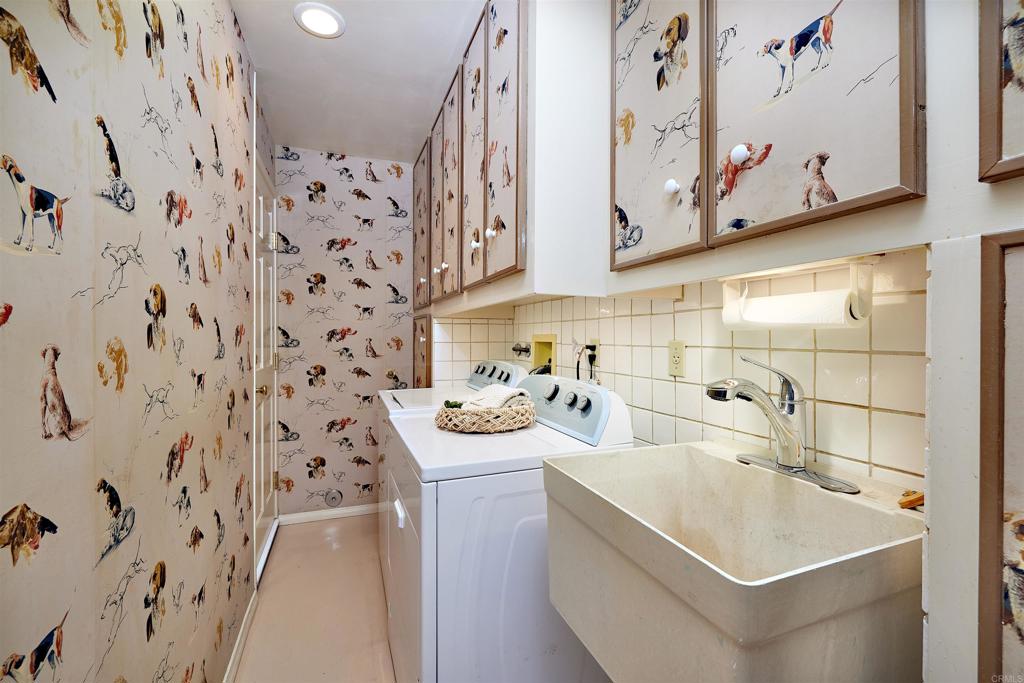 219 Calle De Sereno Encinitas, CA 92024 - Photo 34 of 43 a bathroom with a sink a toilet and shower curtain