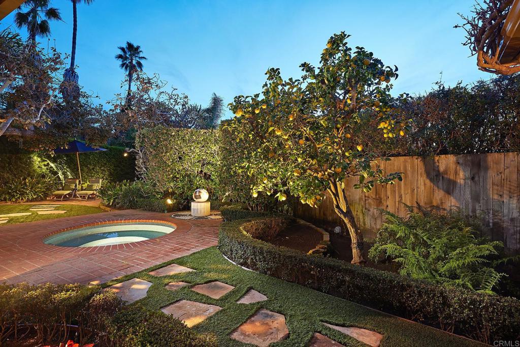219 Calle De Sereno Encinitas, CA 92024 - Photo 5 of 43 a view of a yard with plants and large trees
