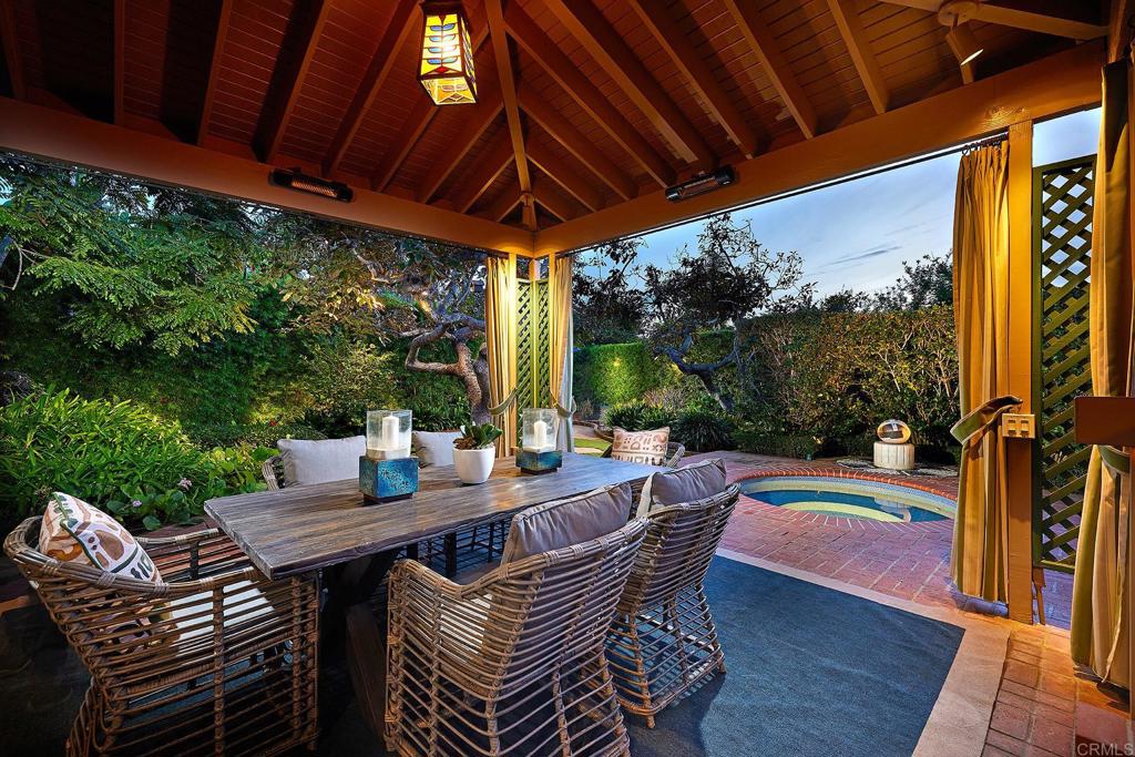 219 Calle De Sereno Encinitas, CA 92024 - Photo 6 of 43 a view of a patio with a table chairs and a backyard