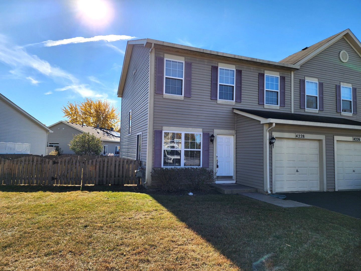 4228 Cummins Street Plano, IL 60545 - Photo 1 of 14 a view of a house with a backyard