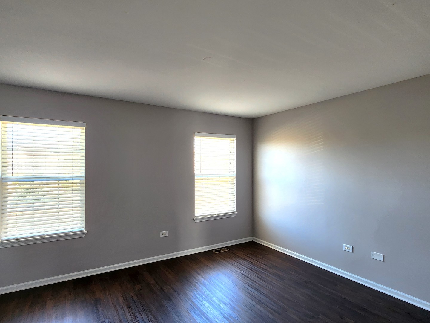 4228 Cummins Street Plano, IL 60545 - Photo 11 of 14 a view of an empty room with wooden floor and a window