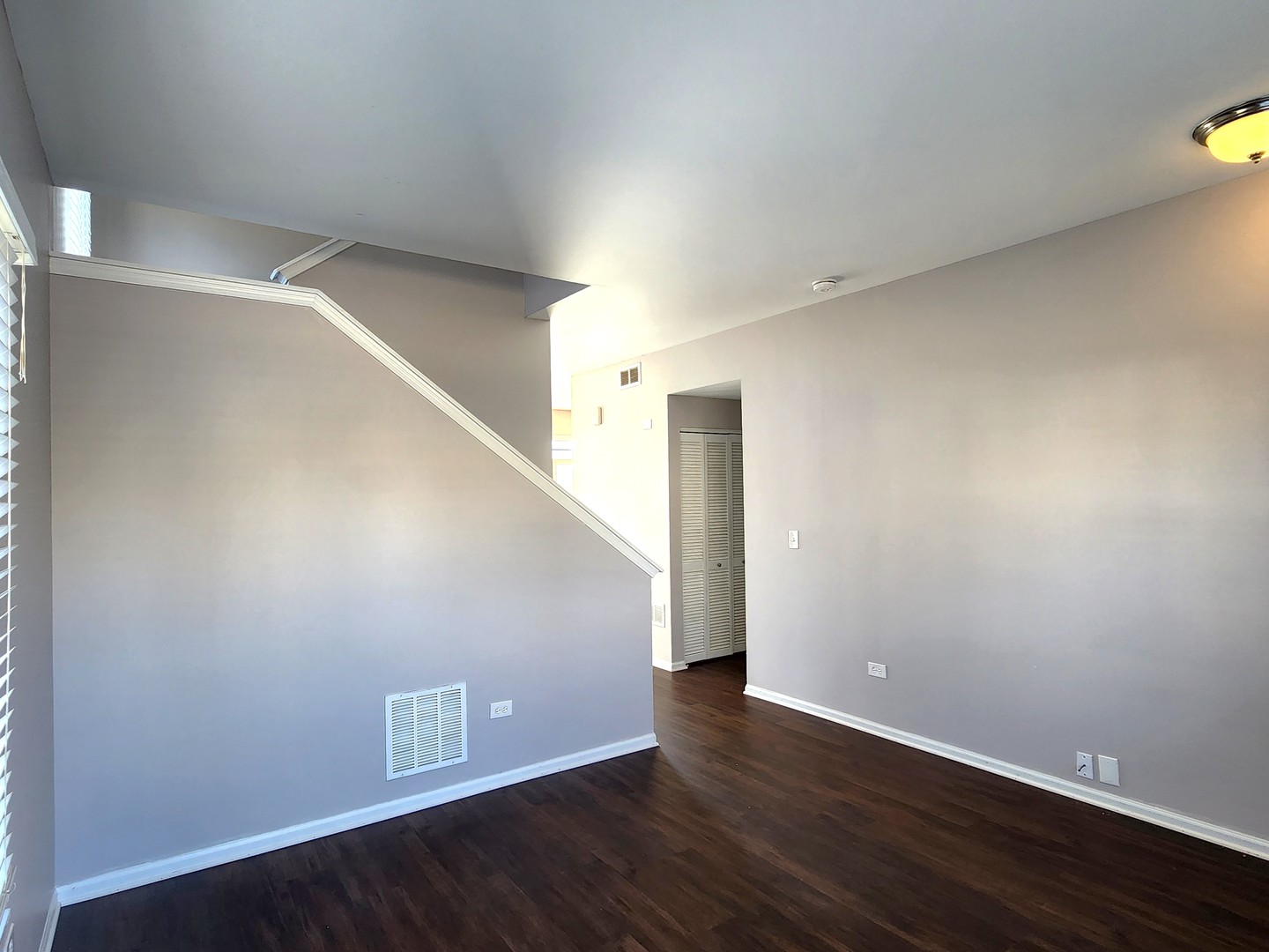 4228 Cummins Street Plano, IL 60545 - Photo 3 of 14 a view of an empty room with wooden floor