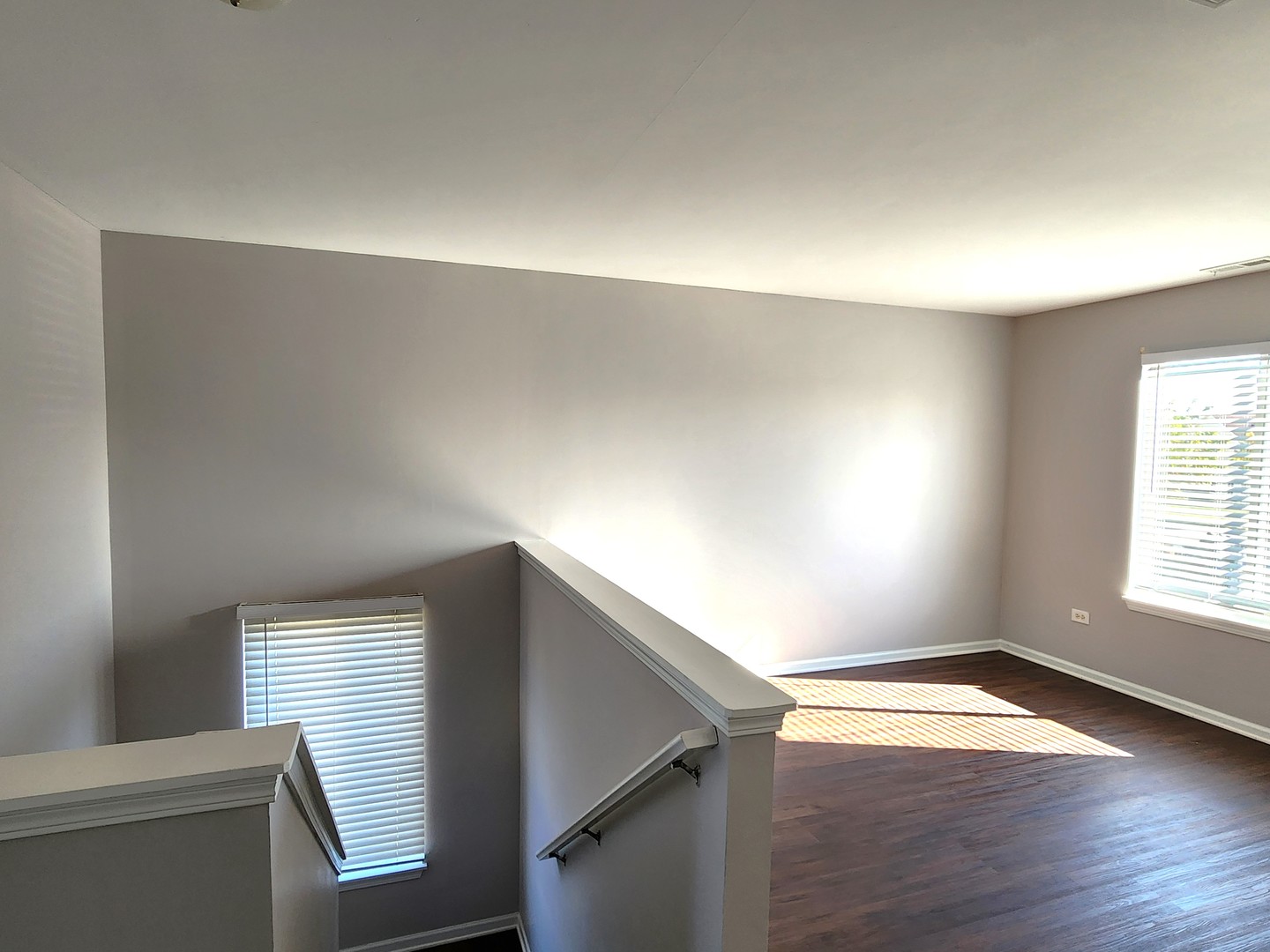 4228 Cummins Street Plano, IL 60545 - Photo 10 of 14 a view of an empty room with wooden floor and a window