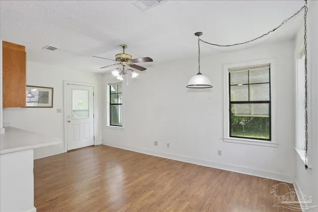 a view of living room with granite countertop furniture and a ceiling fan