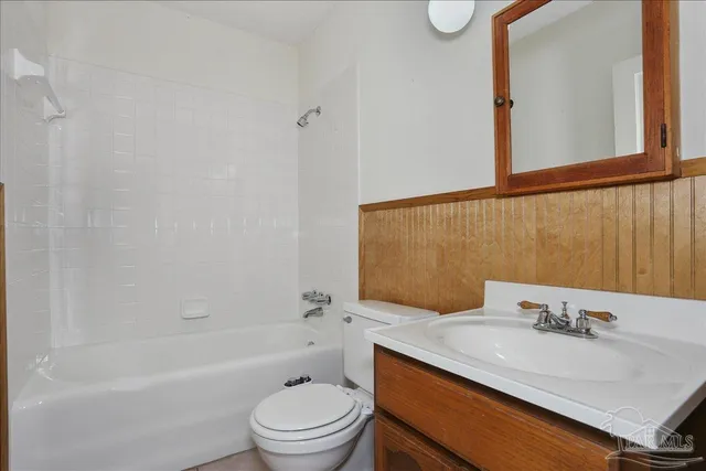 an empty room with fan and windows