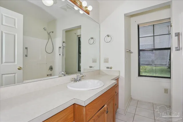 a view of hallway with stairs and wooden floor