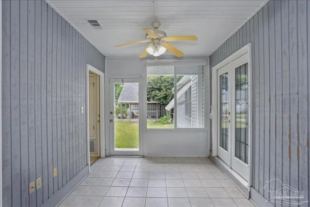 a view of room with window and a ceiling fan