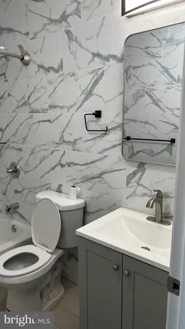 a bathroom with a sink and a toilet
