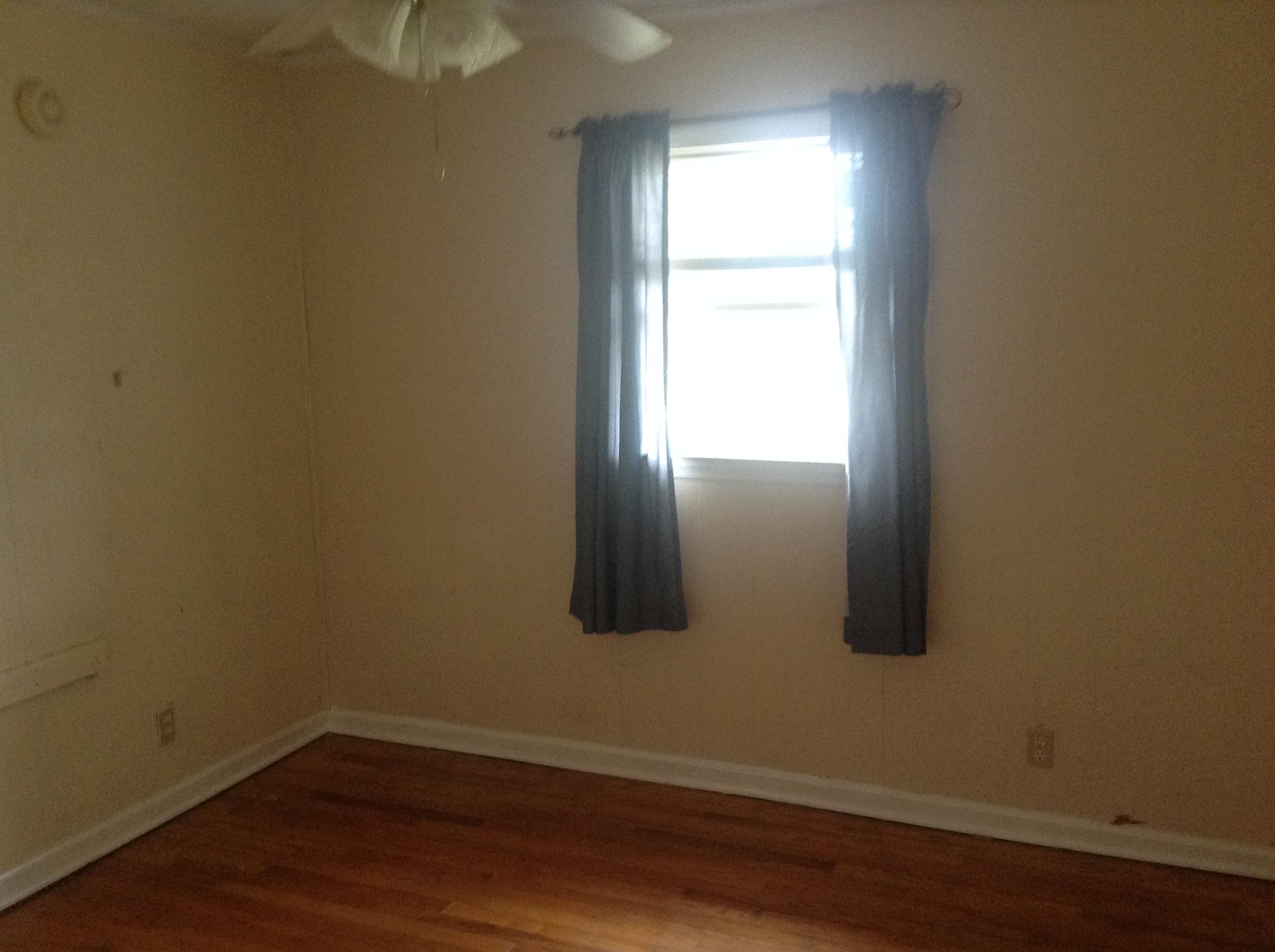 640 Power Dam Road Rocky Mount, VA 24151 - Photo 5 of 9 a view of an empty room with wooden floor and a window