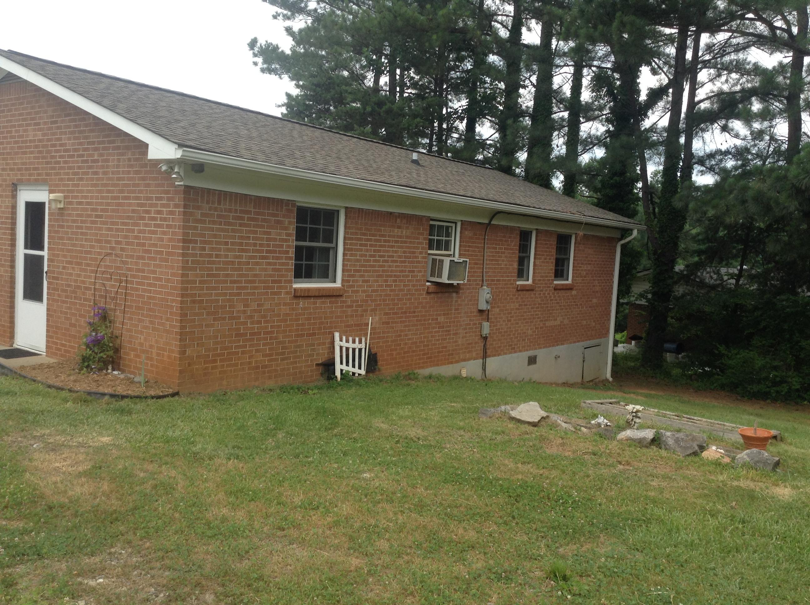 640 Power Dam Road Rocky Mount, VA 24151 - Photo 9 of 9 a backyard of a house with table and chairs