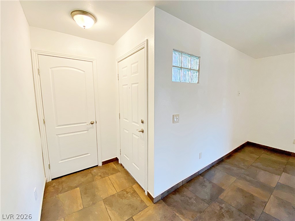 3145 East Flamingo Road, Unit 1128 Las Vegas, NV 89121 - Photo 3 of 19 A well-lit entry with rich tile flooring and an inviting ambiance.