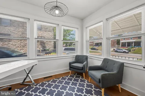 a bedroom with a bed and a chair