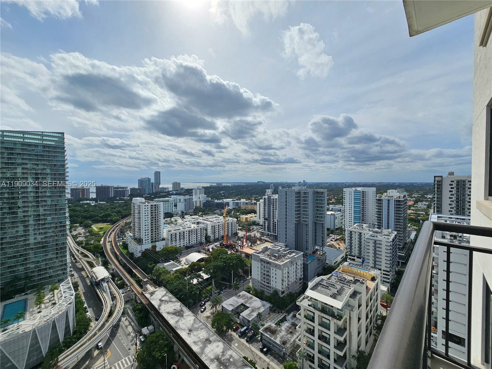 999 Southwest 1st Avenue, Unit 3004 Miami, FL 33130 - Photo 21 of 36 a view of a balcony with furniture