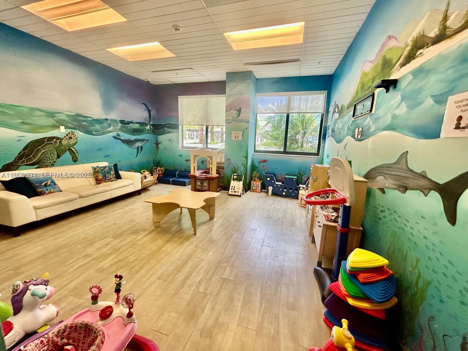 999 Southwest 1st Avenue, Unit 3004 Miami, FL 33130 - Photo 29 of 36 a living room with furniture and a floor to ceiling window