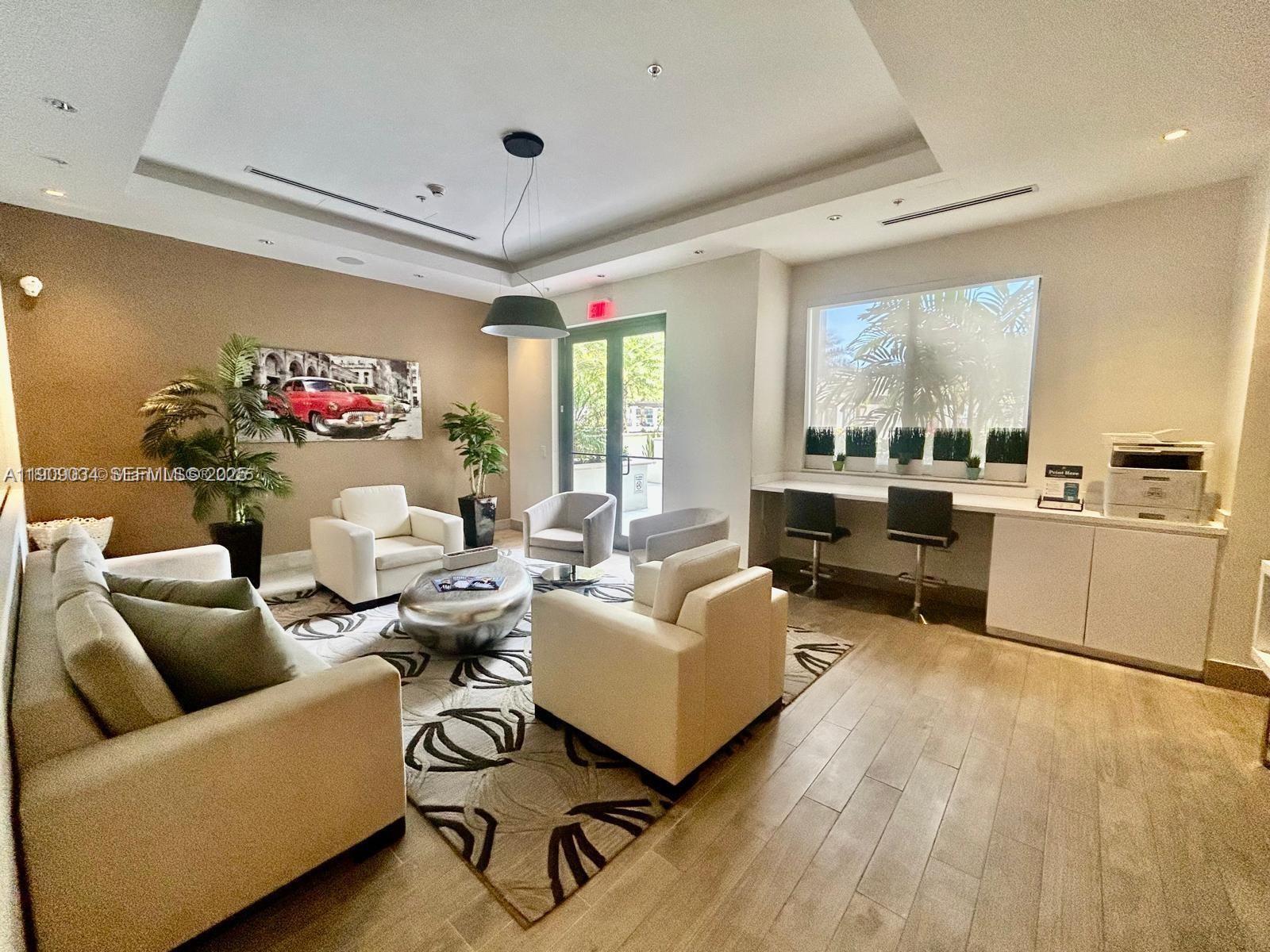 999 Southwest 1st Avenue, Unit 3004 Miami, FL 33130 - Photo 30 of 36 a living room with furniture and a large window