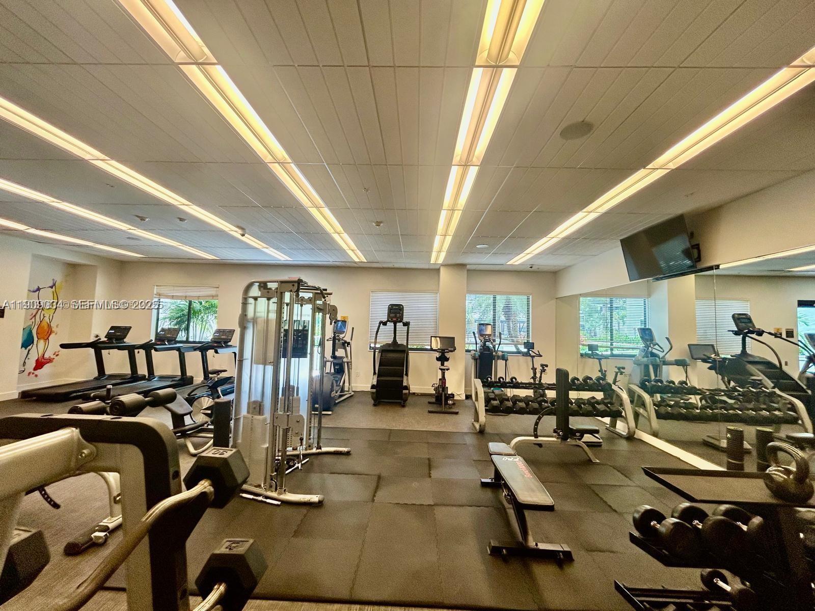 999 Southwest 1st Avenue, Unit 3004 Miami, FL 33130 - Photo 33 of 36 a view of a room with gym equipment