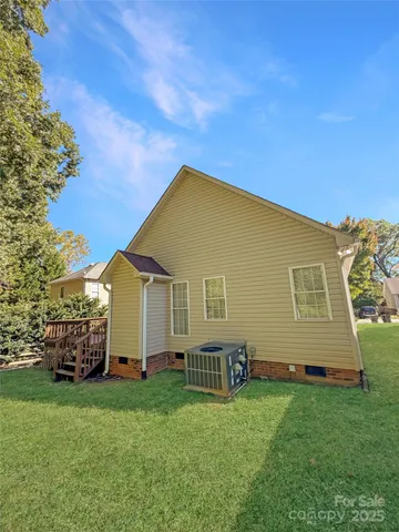 a view of a backyard with potted plants