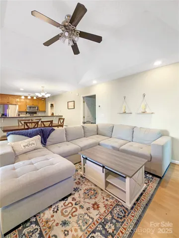 a living room with furniture and a rug