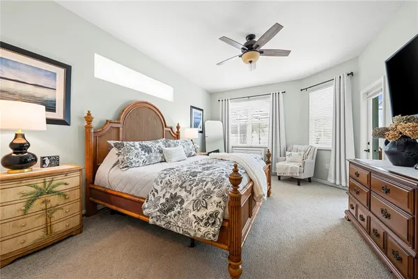 a bed room with a bed and a tv