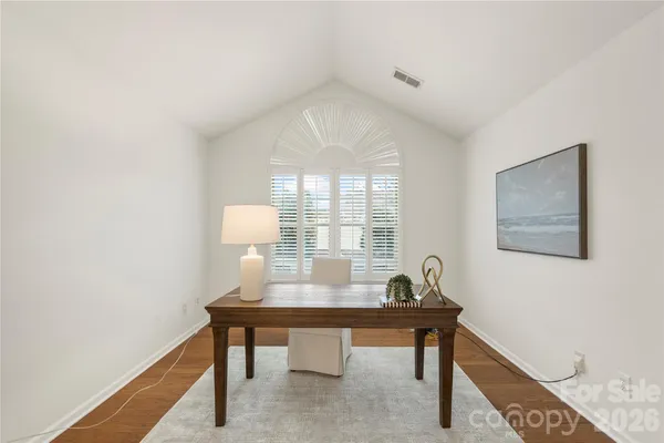 a workspace with furniture and window